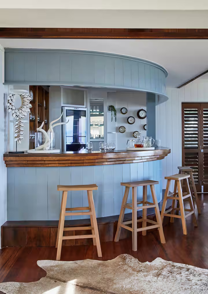 Curved bar with wooden stools