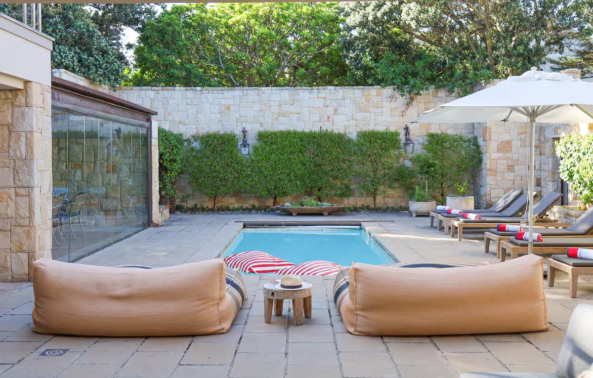 Sheltered courtyard with loungers and daybeds