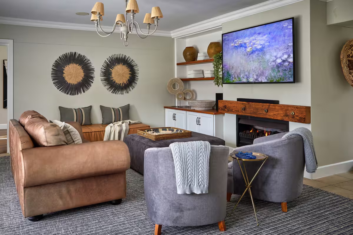 Snug lounge with fireplace and armchairs